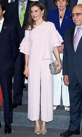 Queen Letizia looked pretty in pink attending a July 2017 meeting in Madrid wearing a ruffle-sleeved top and matching pants, each priced at $49.90, from <b>Zara</B>.
Photo: Carlos Alvarez/Getty Images