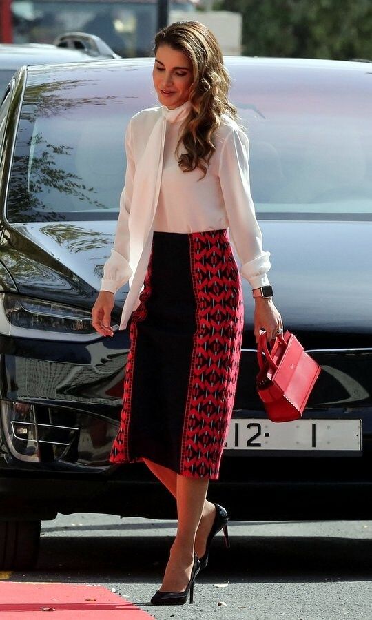 Here's a little officewear inspo from Queen Rania of Jordan! The monarch's wife attended the opening of parliament in Amman on November 12 wearing a red and black pencil skirt with a white pussy-bow blouse. The royal carried an on-trend mini bag the Horizon Mini Leather Satchel by Givenchy for the occasion.
Photo: KHALIL MAZRAAWI/AFP/Getty Images