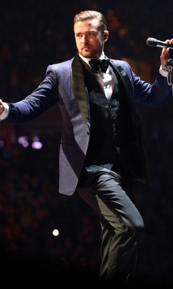 Justin stepped up his suit game a notch and wore a navy tux during the tour that brought him all over the world.
<br>
Photo: Getty Images