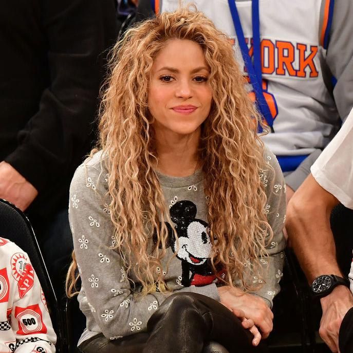 Shakira in a sporty outfit with her hair down