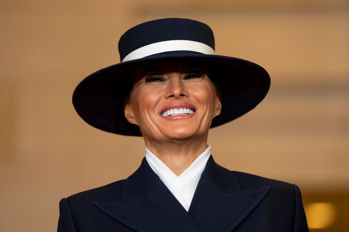 First lady Melania Trump looks on as her husband U.S. President Donald Trump addresses guests and supporters