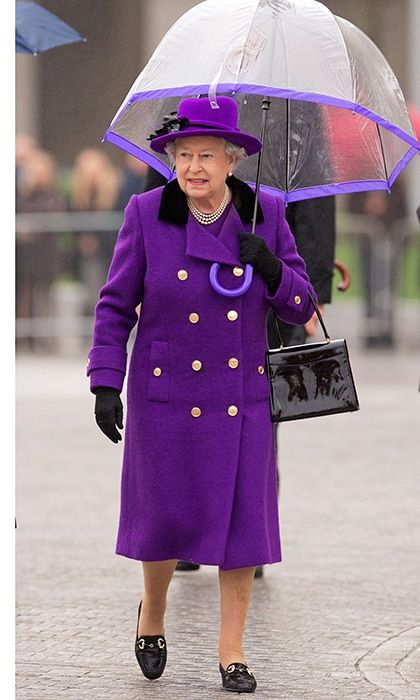 Purple and rain at the new Jubilee Gardens on October 25, 2012. Queen Elizabeth gave a masterclass in accessorizing with her patent leather purse and shoes, and matching hat, coat and gloves which went perfectly with her clear umbrella, natch.
Photo: Getty Images