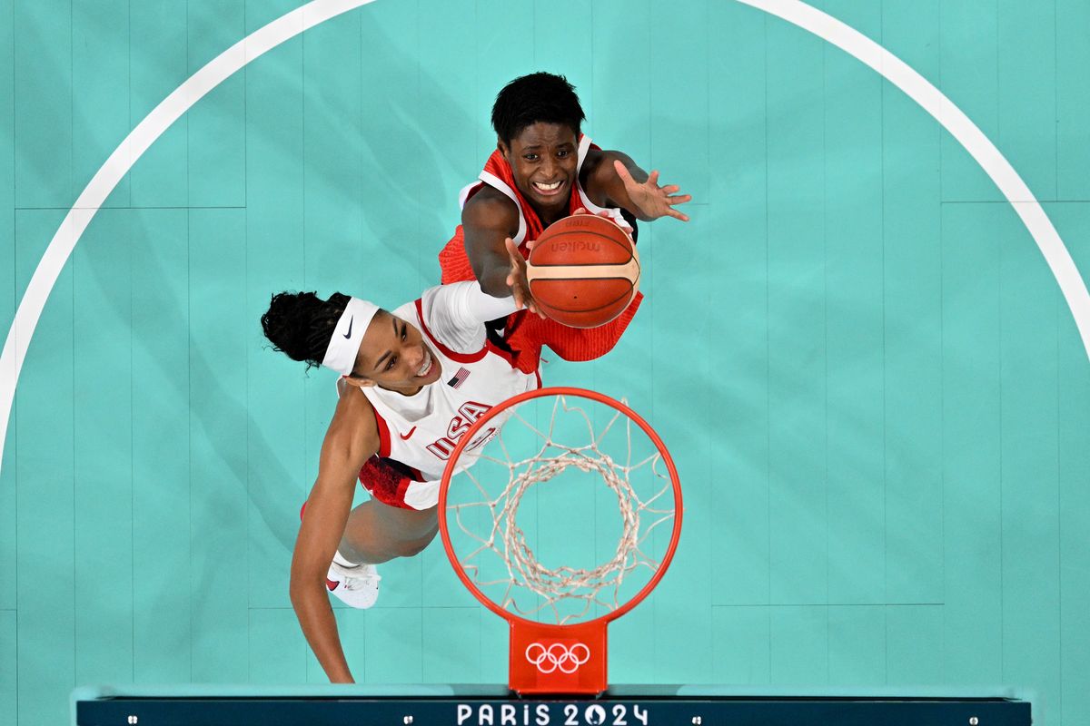 A'Ja Wilson #9 of Team United States and Evelyn Mawuli #30 of Team Japan battle for a rebound during the Women's Group Phase - Group C game between Japan and United States on day three of the Olympic Games Paris 2024 at Stade Pierre Mauroy on July 29, 2024, in Lille, France. (Photo by Pool/Getty Images)