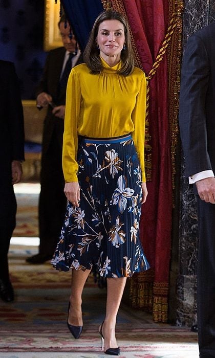 Queen Letizia of Spain looked to one of her favorites as she greeted Palestinian President Mahmoud Abbas at the Royal Palace in Madrid on November 20. The royal wore a mustard blouse and floral print pleated skirt by BOSS by Hugo Boss.
Photo: Antonio Gutierrez - Pool/Getty Images