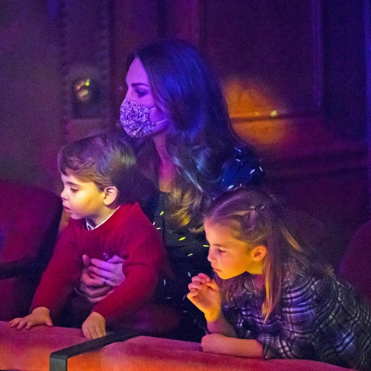 Charlotte and her little brother were engrossed by what was happening on stage.