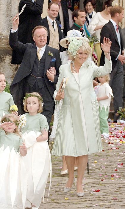 The Duchess was lovely in a mint green silk coat dress. Seen behind her, left, is the father-of-the bride.
Photo: Getty Images