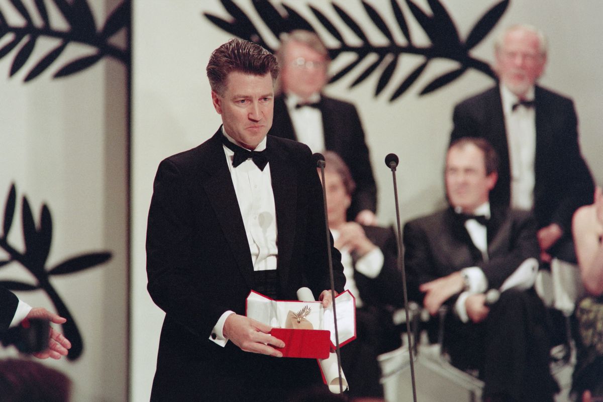 David Lynch poses with The Palme d'Or for his movie "Wild at Heart" 