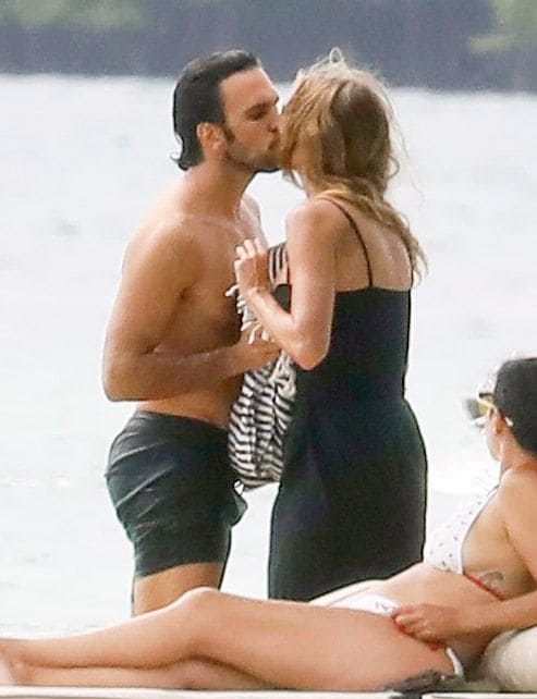 Gisele Bundchen and Joaquim Valente pack on the PDA during a boat ride with friends in Miami