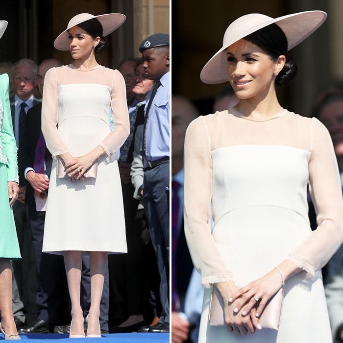 Just three days after her and Prince Harry's royal wedding, Meghan the Duchess of Sussex attended her first Buckingham garden party in style. The former actress was ready for her closeup as she joined Harry at their first official engagement as a married couple, appearing at a charity event at Buckingham Palace held as part of Prince Charles's 70th birthday celebrations. For the occasion, Meghan wore a design by Goat which featured sheer long sleeves and an empire waist. She accessorised with a pale pink clutch and shoes, as well as a matching hat.
Photos: Getty Images