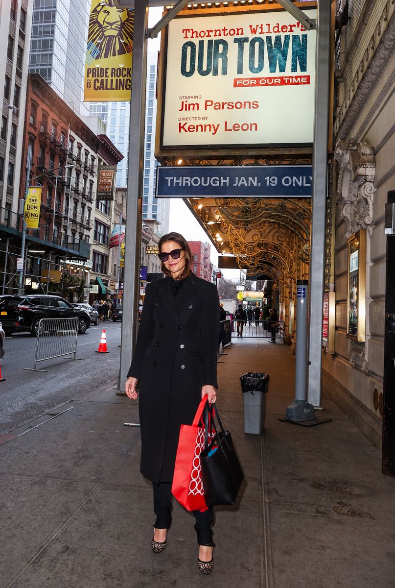 Katie Holmes standing outside of the theater where "Our Town" is playing