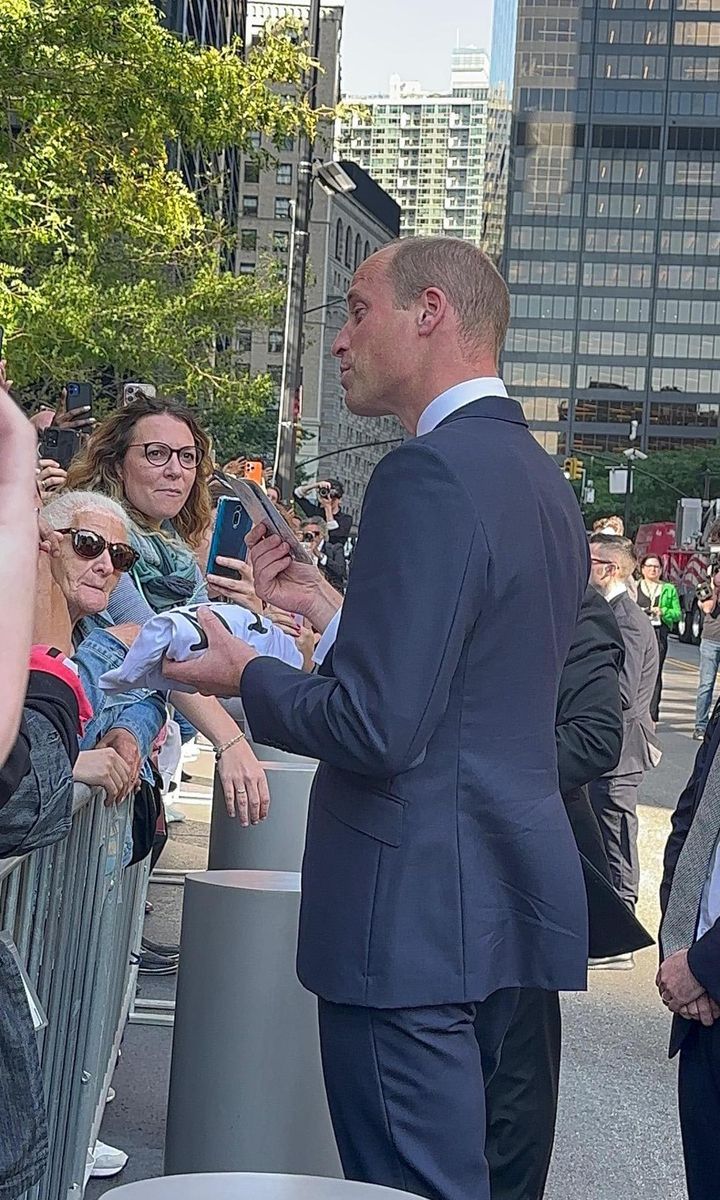 The Prince of Wales greeted well wishers after his engagement at FDNY Ten House