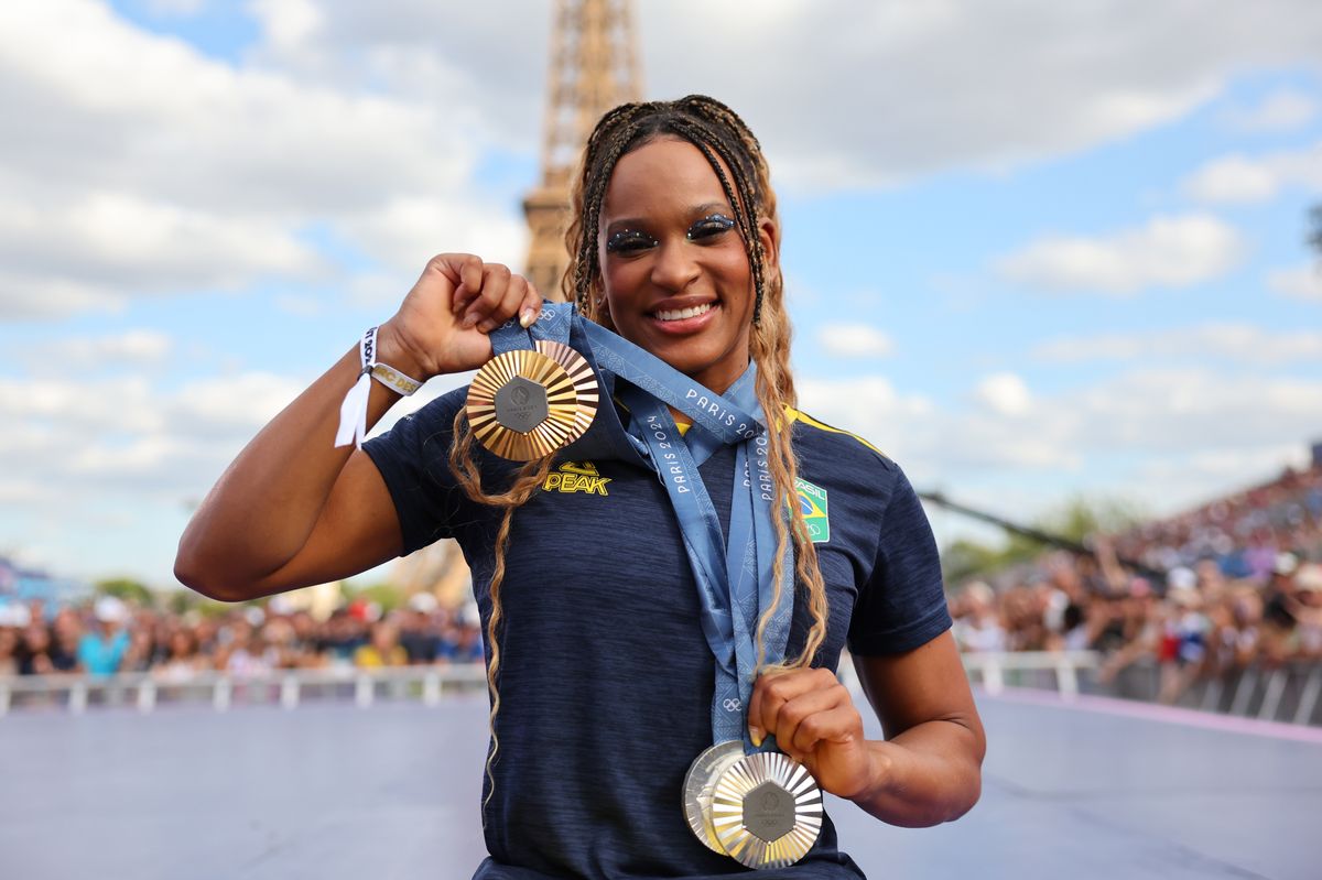 Women's Artistic Gymnastics medalist Rebeca Andrade of Team Brazil poses for a photo with her medals on day twelve of the Olympic Games Paris 2024 at Champions Park on August 07, 2024, in Paris, France. (Photo by Michael Reaves/Getty Images)