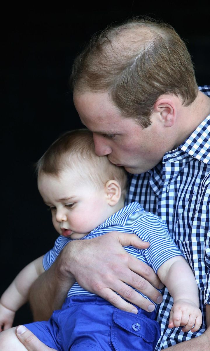 While Down Under in Australia, Prince William gently kissed baby George's head at the Taronga Zoo in 2014.