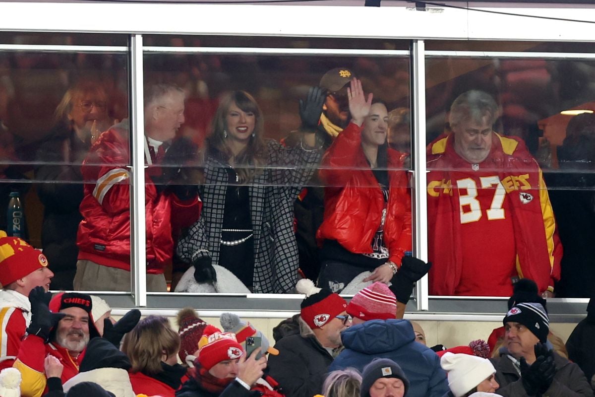 KANSAS CITY, MISSOURI - JANUARY 18: Taylor Swift and Caitlin Clark celebrate during an NFL football game between the Houston Texans and Kansas City Chiefs at GEHA Field at Arrowhead Stadium on January 18, 2025 in Kansas City, Missouri. (Photo by Perry Knotts/Getty Images)