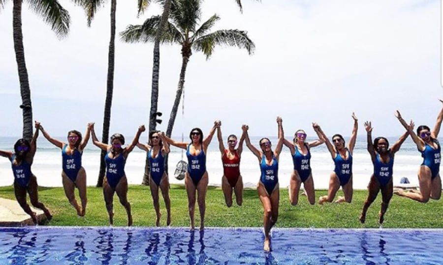 To celebrate her 38th birthday, Kourtney Kardashian and her girl squad jetted to Mexico where her friends wore matching customized bathing suits that read SPF 1942. The birthday girl opted for a red suit that read Mamacita before jumping into the pool.
Take a look at some of our favorite swimsuits that will make a big statement whether you wear them on the beach, at the pool or just around with a pair of shorts.
Photo: Instagram/@kourtneykardash