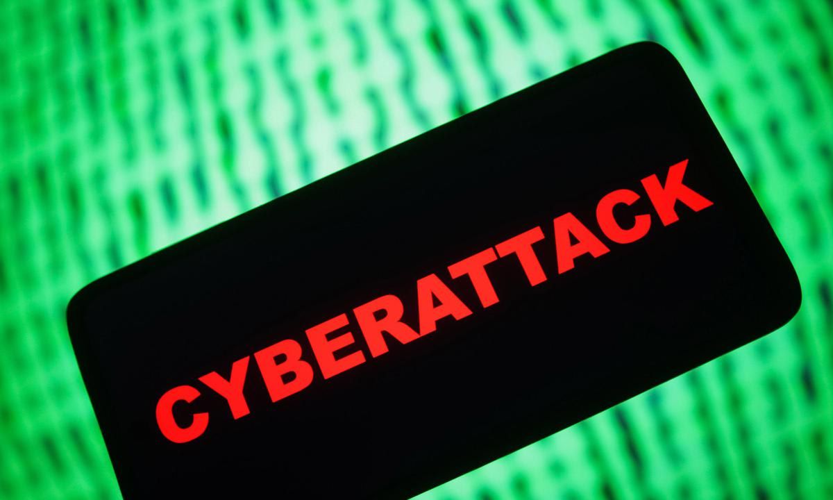 In this photo illustration, a Cyberattack word logo is