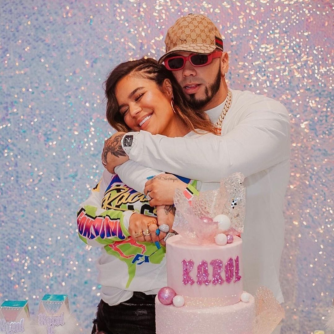 Karol G and Anuel AA posing together at her birthday party