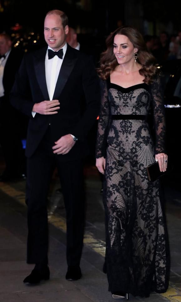 Kate Middleton in a black lace dress and Prince William in a black suit