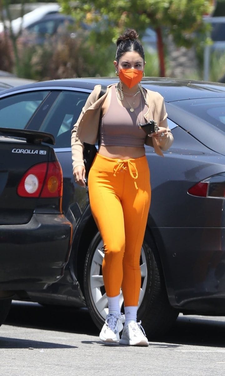 Vanessa Hudgens Turns Heads in Bright Orange Pants, Matching Mask & Cropped Tank!