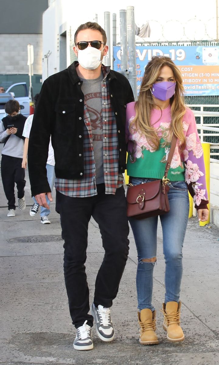 Ben Affleck and Jennifer Lopez hold hands as they head to the movies with their kids at Regency Theater in Westwood.