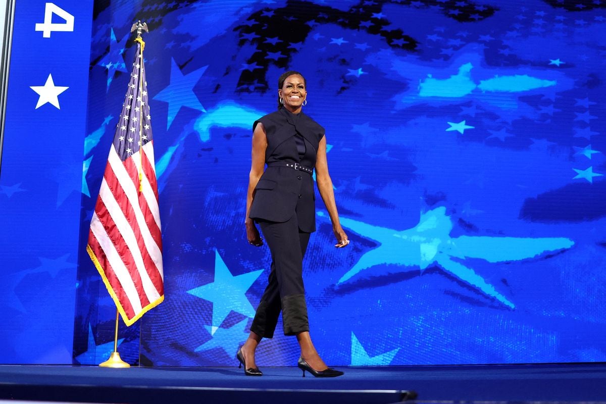 Former US First Lady Michelle Obama arrives to speak on the second day of the Democratic National Convention (DNC) at the United Center in Chicago, Illinois, on August 20, 2024. Vice President Kamala Harris will formally accept the party's nomination for president at the DNC which runs from August 19-22 in Chicago. (Photo by CHARLY TRIBALLEAU / AFP) (Photo by CHARLY TRIBALLEAU/AFP via Getty Images)