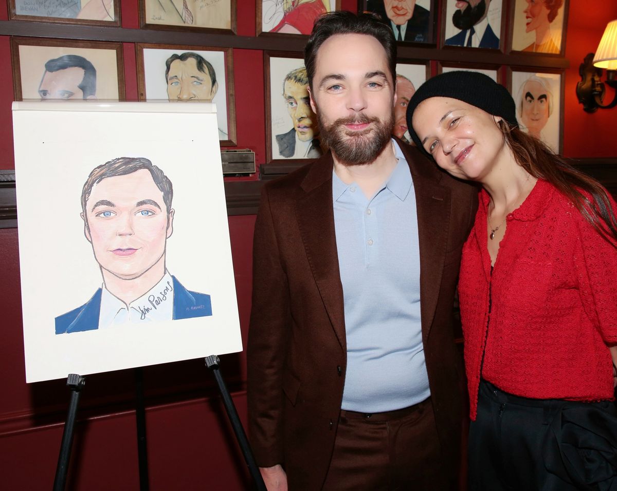 Katie Holmes and Jim Parsons next to Parsons' portrait