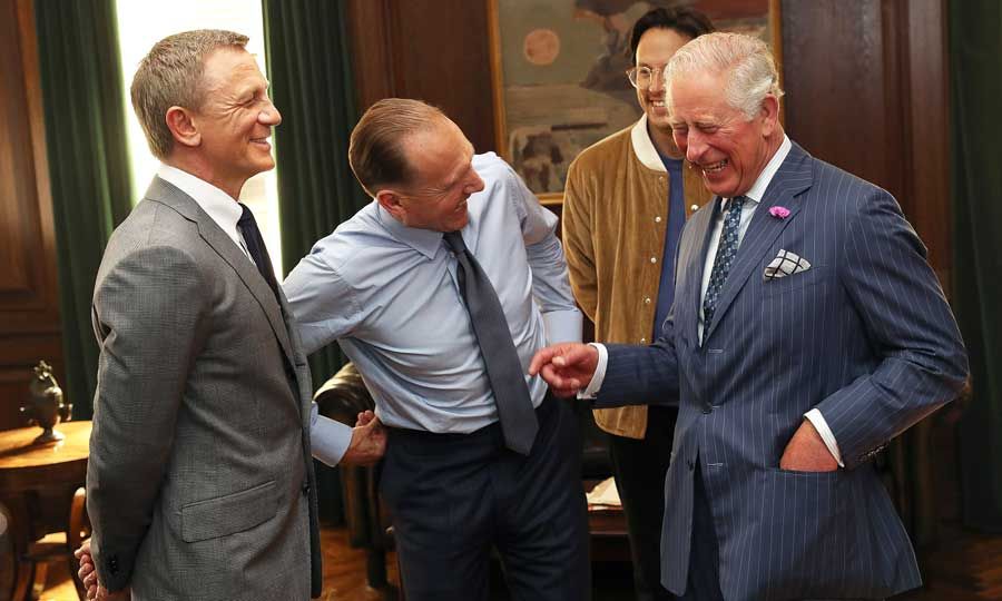 Daniel Craig and Ralph Fiennes meeting King Charles as he visited the set of 007