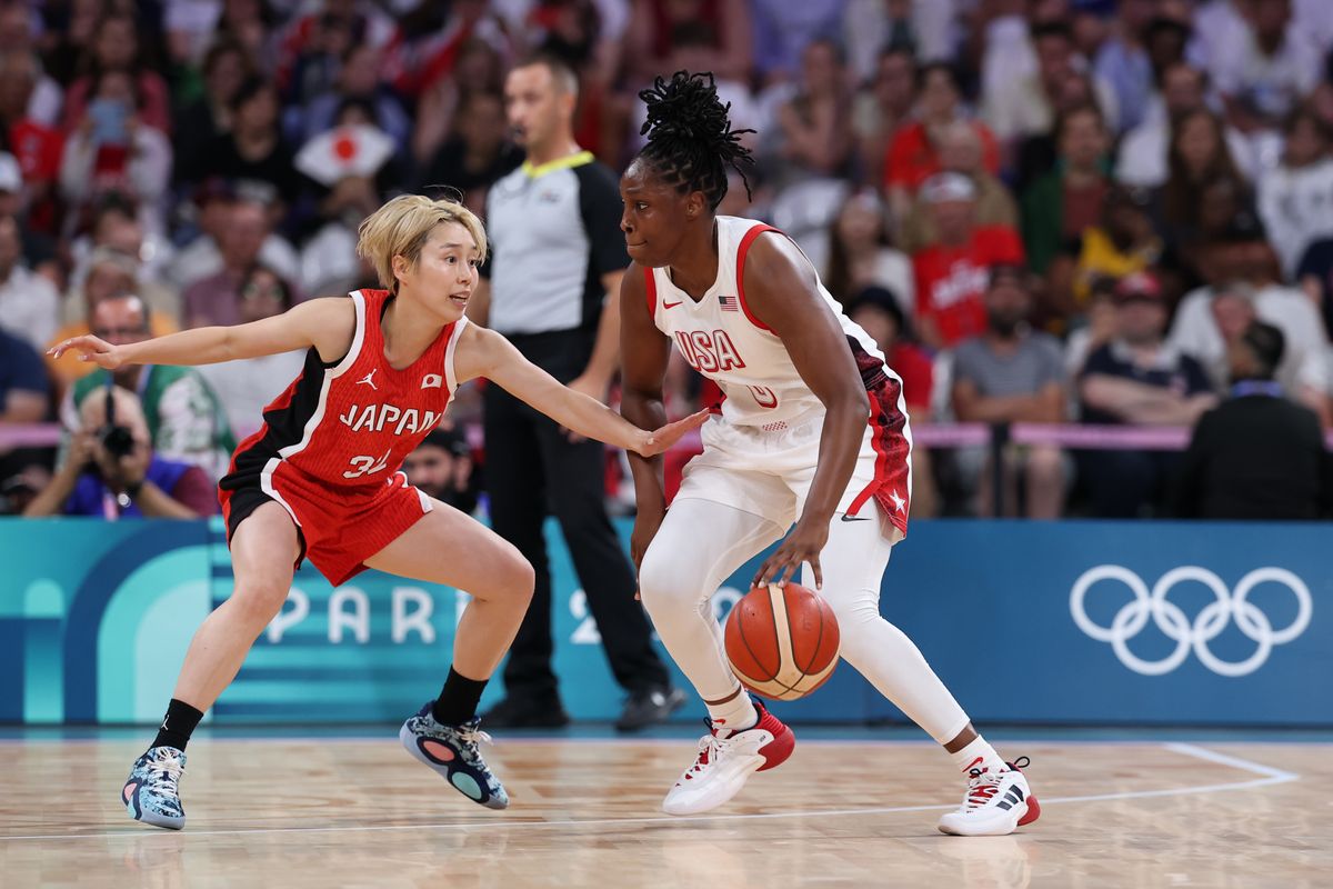 Saori Miyazaki #32 of Team Japan defends Chelsea Gray #8 of Team United States during the Women's Group Phase - Group C game between Japan and United States on day three of the Olympic Games Paris 2024, at Stade Pierre Mauroy on July 29, 2024, in Lille, France. (Photo by Gregory Shamus/Getty Images)
