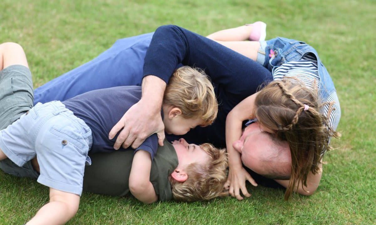 Prince William was tackled by his kids in a sweet photo released to celebrate his 38th birthday in June.