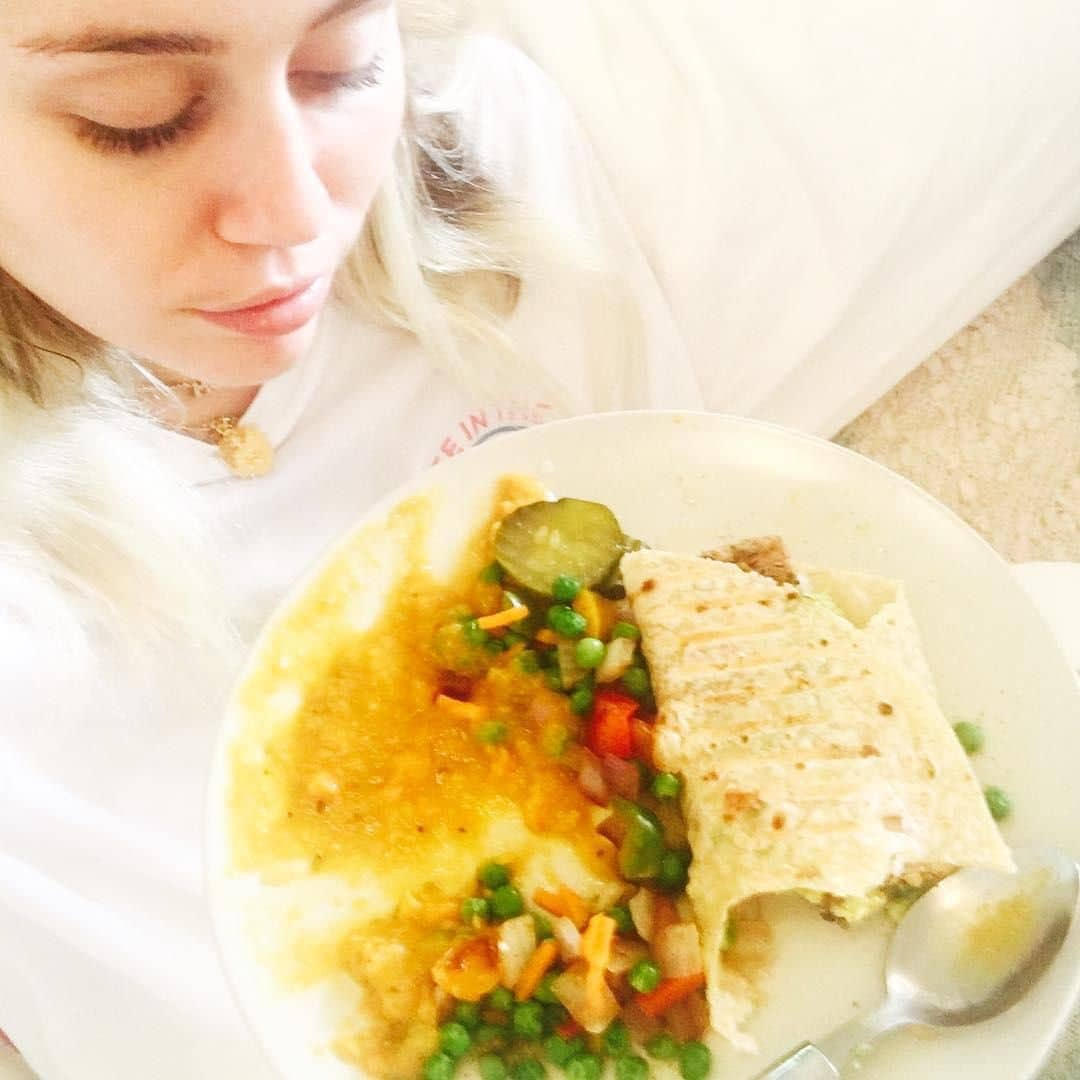 Miley Cyrus eating a vegan dish