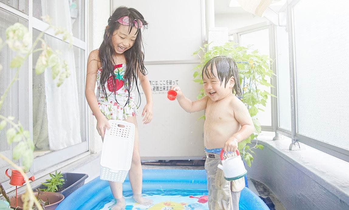 Kids having fun in an inflatable pool