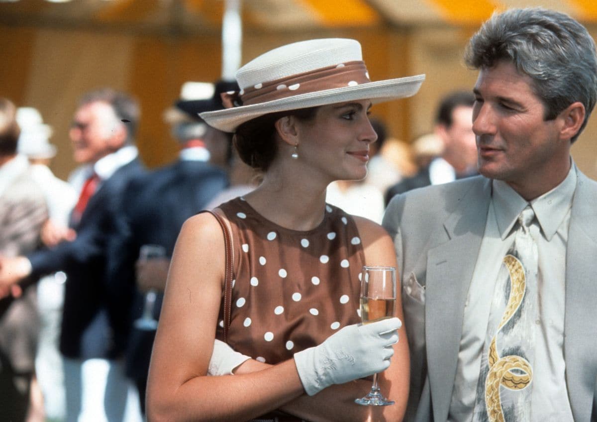 Julia Roberts has a drink with Richard Gere in a scene from the film 'Pretty Woman', 1990. (Photo by Buena Vista/Getty Images)