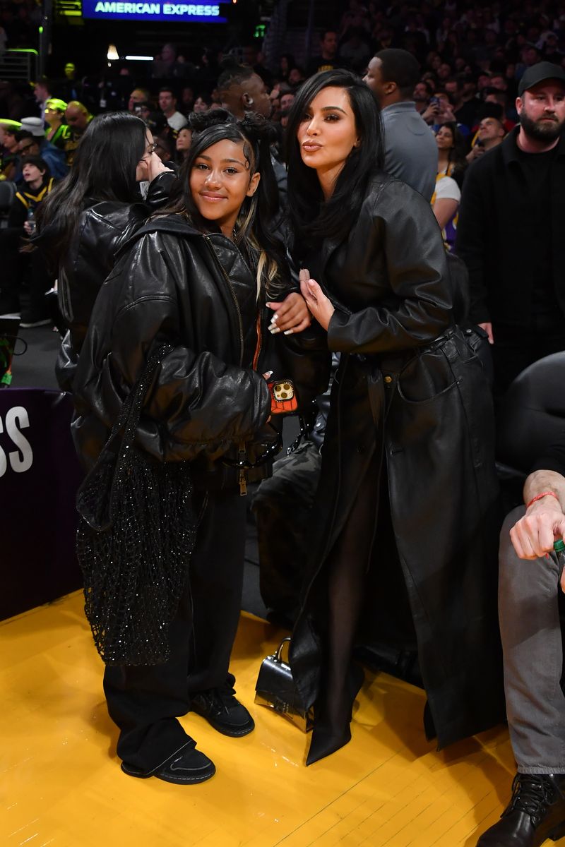 Kim Kardashian and North West attend a basketball game between the Los Angeles Lakers and the Golden State Warriors 