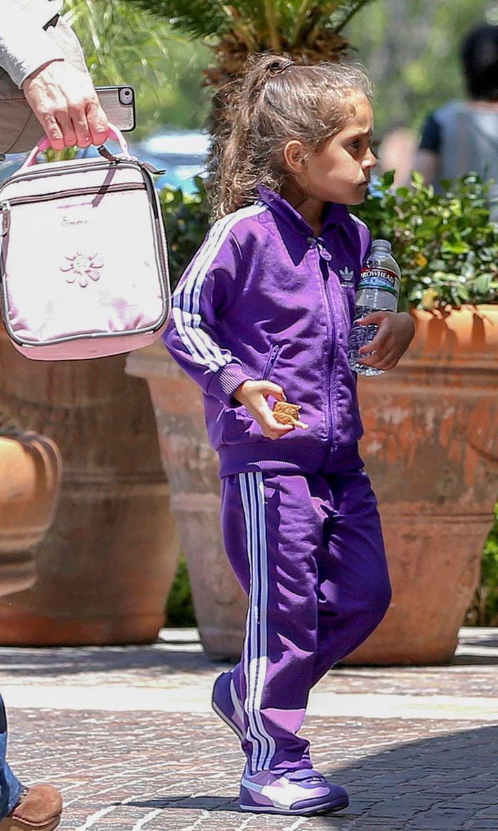 Emme Muniz wearing a purple tracksuit in 2013.