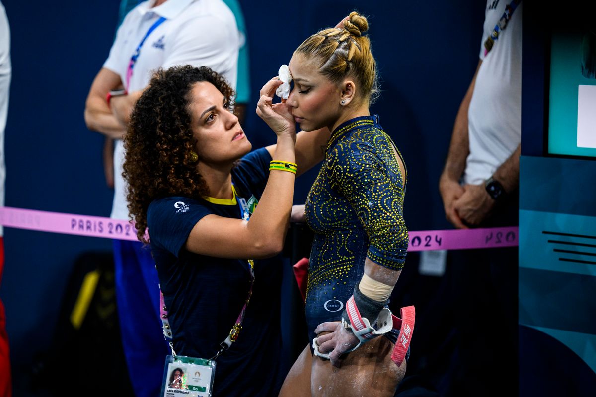 Flavia Saraiva of Team Brazil receives medical treatment during the Artistic Gymnastics Women's Team Final on day four of the Olympic Games Paris 2024 at the Bercy Arena on July 30, 2024, in Paris, France. (Photo by Tom Weller/VOIGT/GettyImages)