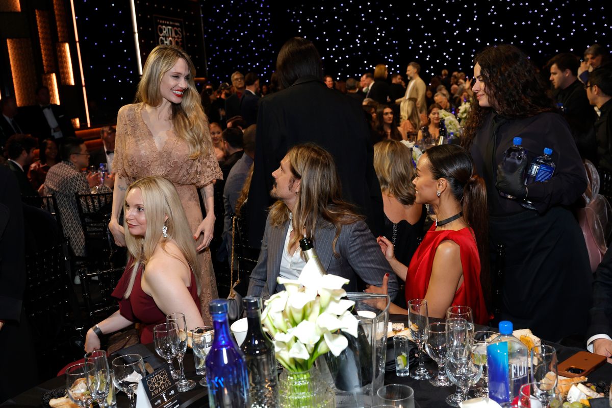 SANTA MONICA, CALIFORNIA - FEBRUARY 07: (L-R) Guest, Angelina Jolie, Marco Perego-SaldaÃ±a, and Zoe Saldana attend FIJI Water at The 30th Critics Choice Awards at Barker Hangar on February 07, 2025 in Santa Monica, California. (Photo by Stefanie Keenan/Getty Images for FIJI Water)