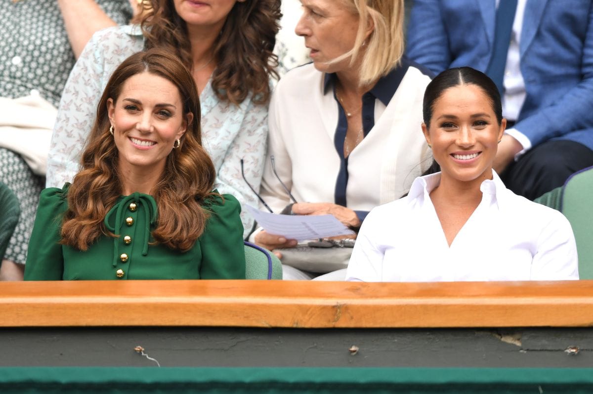 LONDON, ENGLAND - JULY 13: Catherine, Duchess of Cambridge and Meghan, Duchess of Sussex in the Royal Box on Centre Court during day twelve of the Wimbledon Tennis Championships at All England Lawn Tennis and Croquet Club on July 13, 2019 in London, England. (Photo by Karwai Tang/Getty Images)