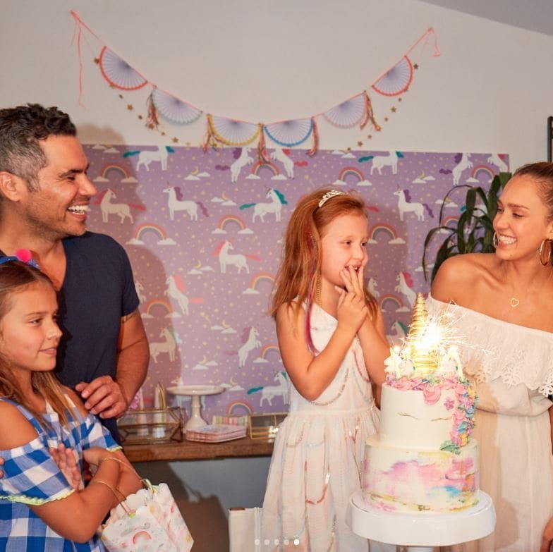 Jessica Alba and Cash Warren treated their youngest daughter Haven to a unicorn-filled birthday party to celebrate turning six. The mom, who is pregnant with her third child wrote on Instagram, "Havie's bday party last weekend was inspired by one of our @honest training pant prints-- you can literally find inspo anywhere. Link in bio to read and see all the magic! ."
The confection was from Cake Creamery that featured cascading flowers and tie-dye as well as a gold horn on top.
Photo: Instagram/@jessicaalba