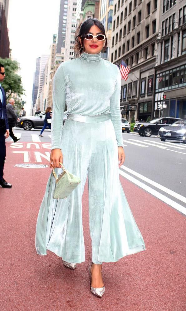 Priyanka Chopra in a pastel green outfit by Lia Cohen, pumps by Jimmy Choo and bag by Cult Gaia