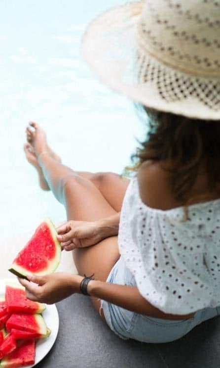 Woman eating watermelon