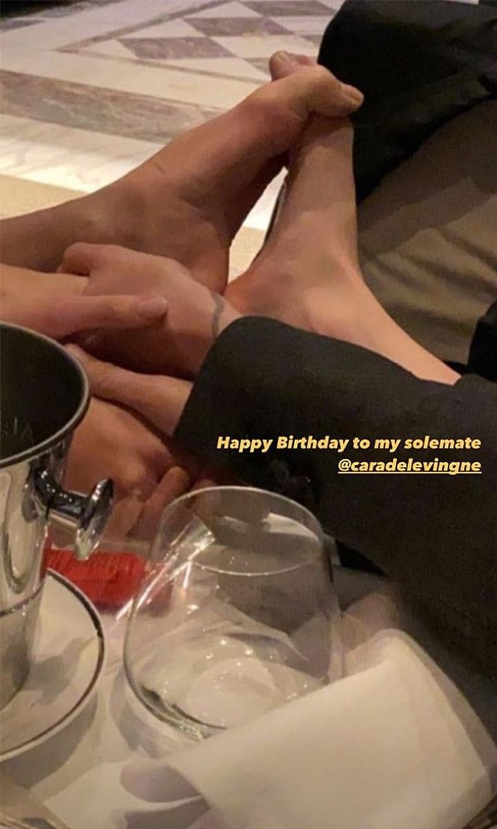 Gerber made it crystal clear who the foot belonged to writing, “Happy birthday to my soulmate @caradelevingne.”