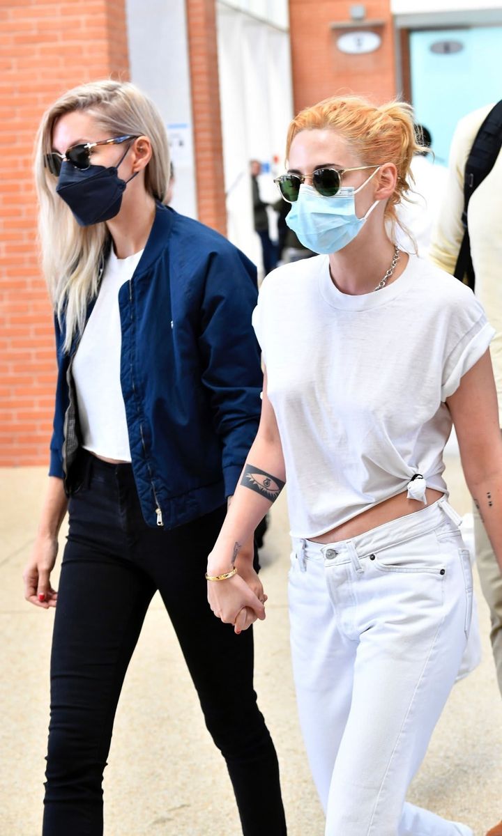 Kristen Stewart holds hands with Dylan Meyer at the 2021 Venice Film Festival