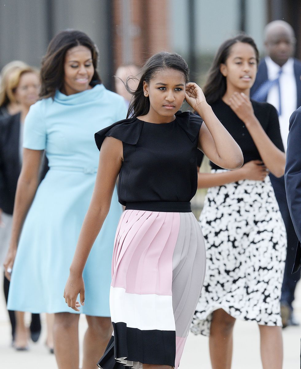 Michelle Obama with daughters Sasha and Malia arrive to welcome His Holiness Pope Francis on his arrival from Cuba September 22, 2015