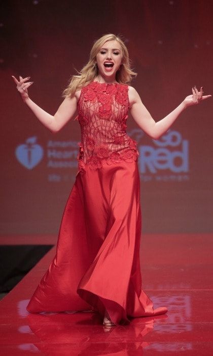 Work that runway! Peyton List sang along as she walked the catwalk during the American Heart Association's Go Red For Women Red Dress Collection fashion show.
Photo: Randy Brooke/WireImage