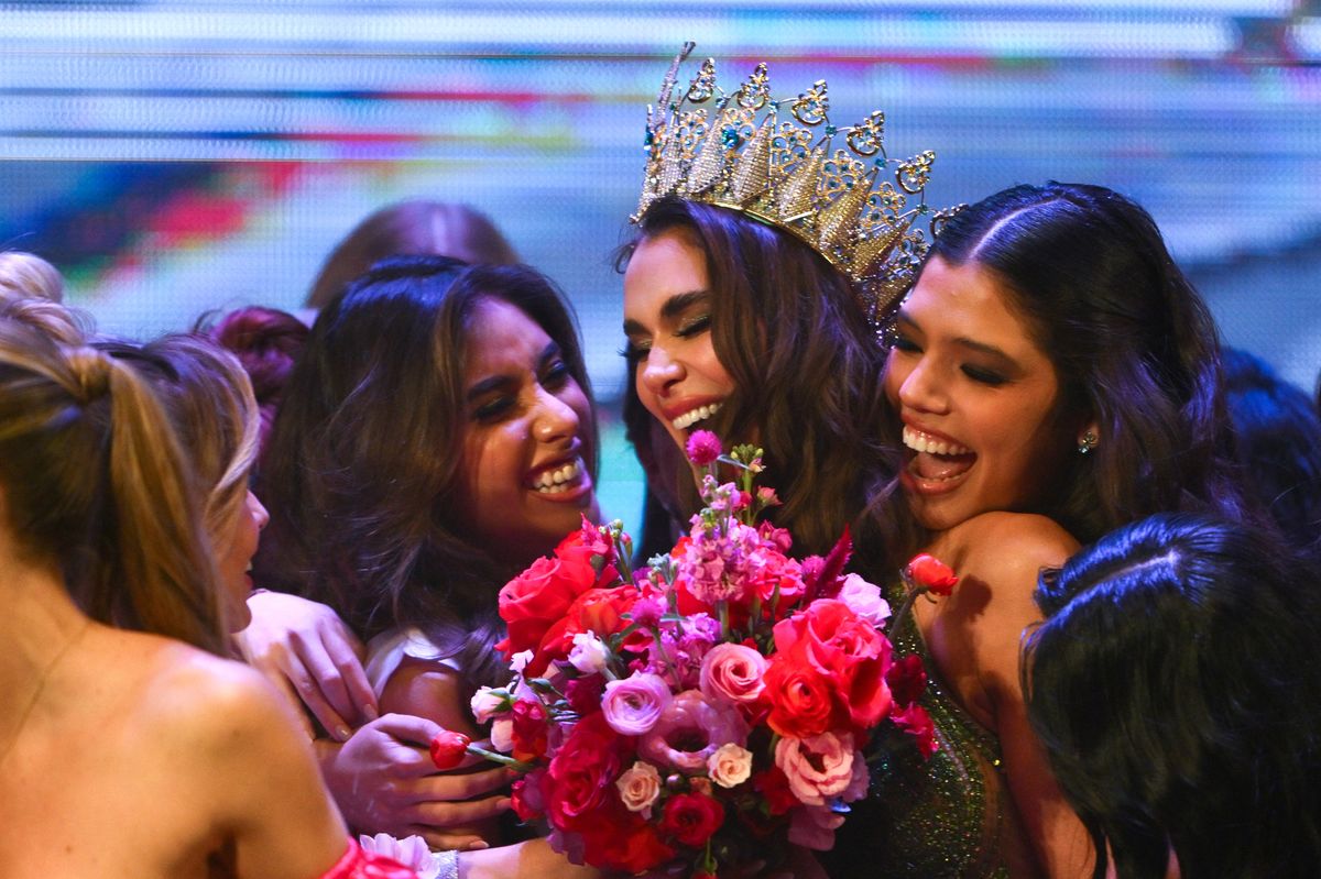 Miss Universe Cordoba 2024 Magaly Benejam (C) celebrates after being crowned Miss Universe Argentina 2024 during the final of Miss Universe Argentina beauty contest in Buenos Aires on May 25, 2024. The winner was the representative of the province of Cordoba, Magaly Benejam, 29, who will represent Argentina in Miss Universe International 2024 to be held in Mexico next September. (Photo by LUIS ROBAYO / AFP) (Photo by LUIS ROBAYO/AFP via Getty Images)