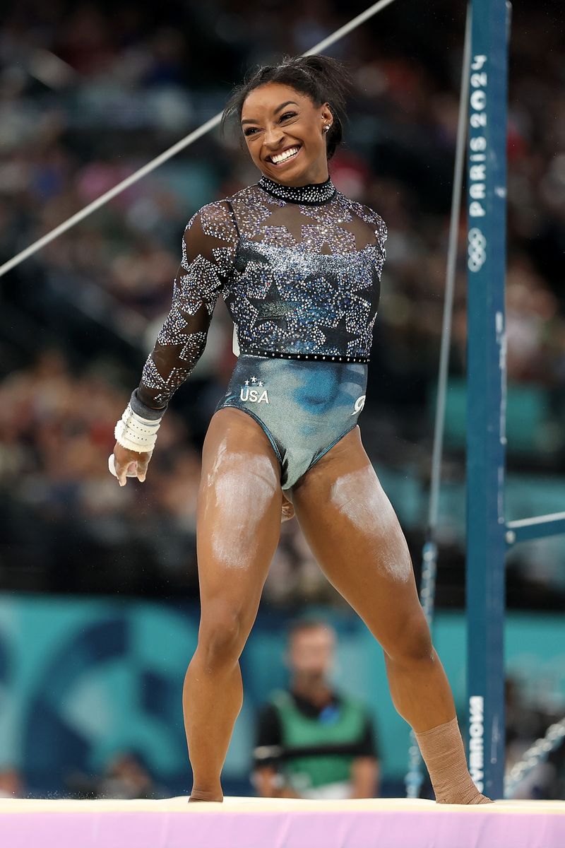 Simone Biles of Team United States reacts after finishing her routine on the uneven bars during the Artistic Gymnastics Women's Qualification on day two of the Olympic Games Paris 2024 at Bercy Arena on July 28, 2024 in Paris, France. (Photo by Ezra Shaw/Getty Images)