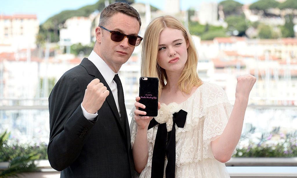 They mean business! <i>The Neon Demon</i> director Nicolas Winding Refn and actress Ellen Fanning hammed it up for cameras during their film's photocall.
<br>
Photo: Dominique Charriau/WireImage