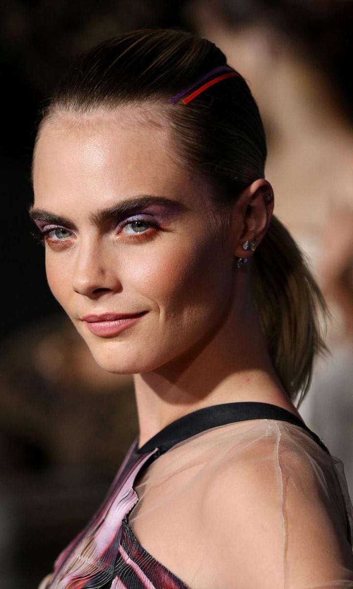 Cara Delevingne incorporates ribbons of colour in her hairstyle