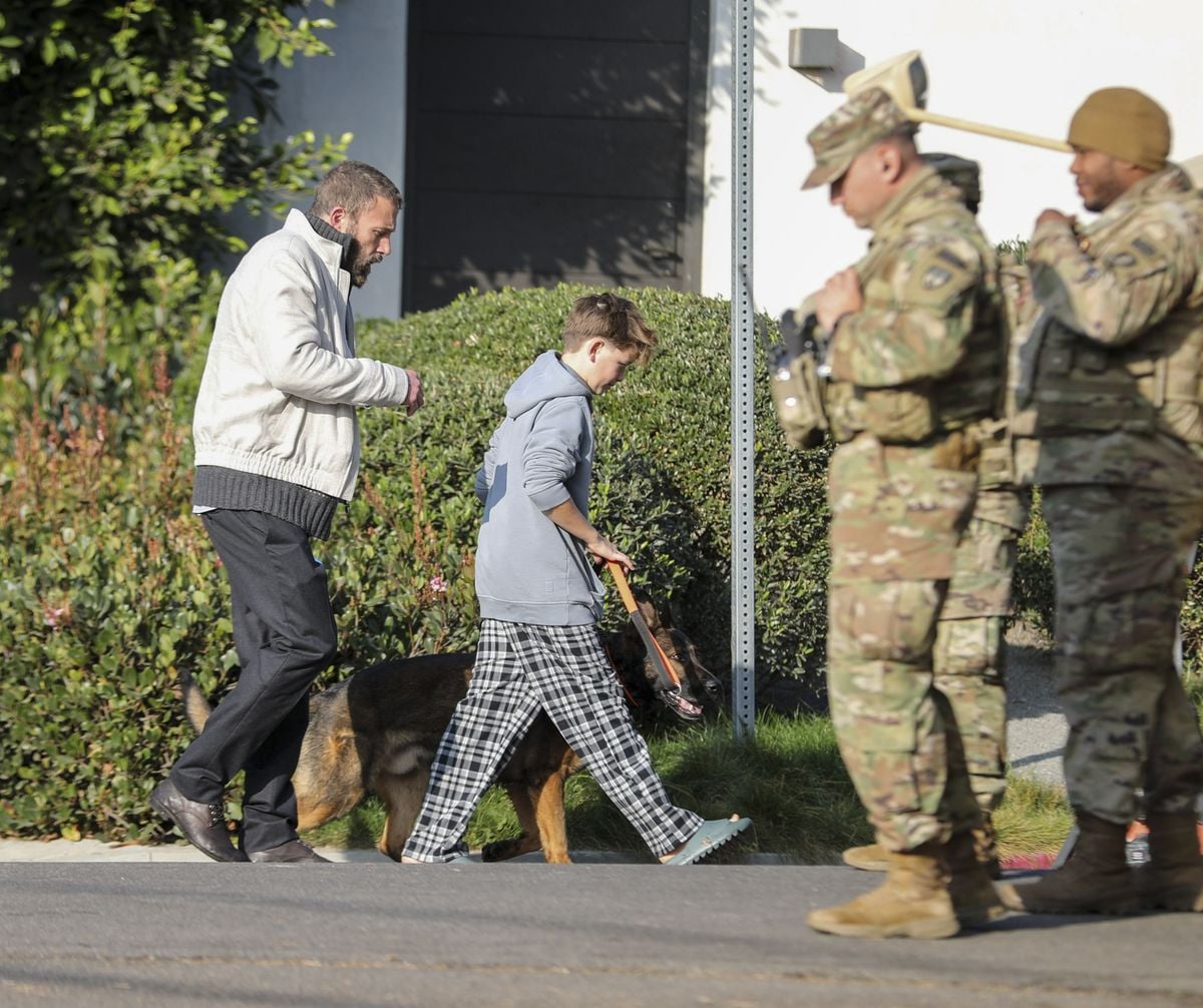 The 52 year old actor and his son were pictured strolling with a dog after two men from Trident Elite Protection Dogs were spotted arriving at the actor home with a large dog crate. 