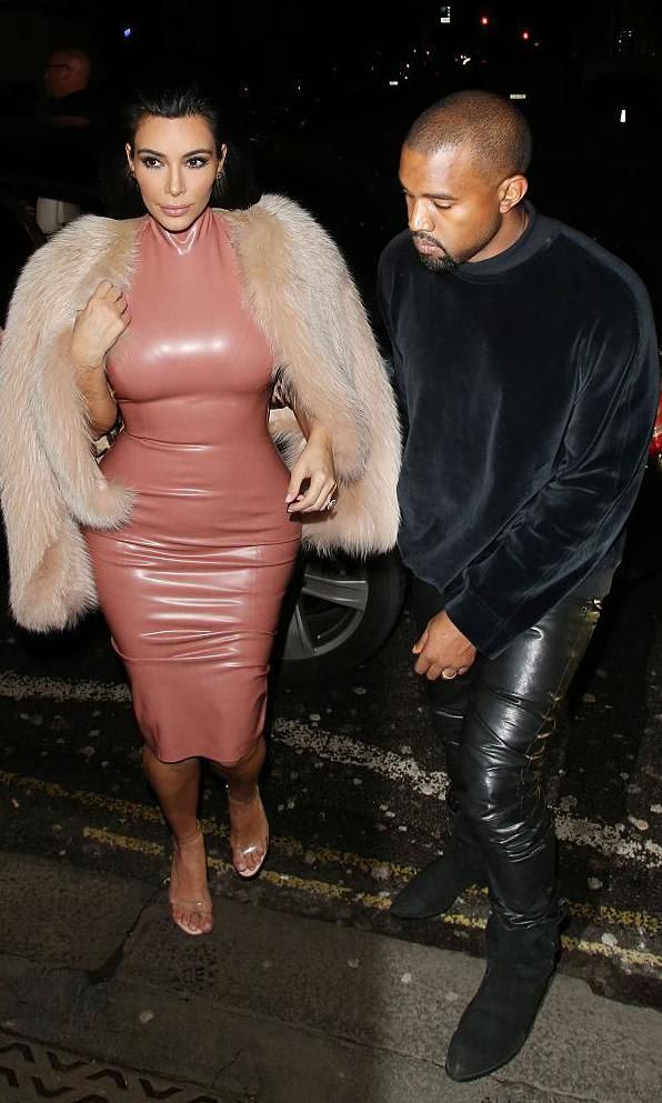 Kim Kardashian in a latex midi dress and fur coat